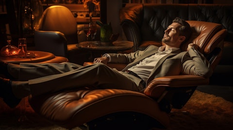 A customer reclining in a luxurious Sactionals chair, surrounded by tasteful and stylish furnishings.