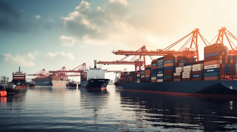 A processional line of imposing cargo ships in a large port, capturing the scope of the company's ocean transportation business.