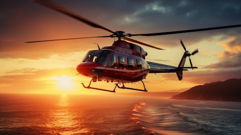 A helicopter taking off against a vibrant sunrise, demonstrating the companies aviation services.