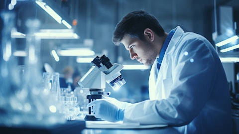 A scientist in a lab coat observing a microscope in a sterile environment, symbolizing the progress of gene therapy.
