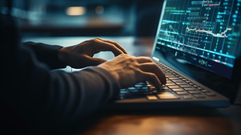 A person's hands typing on a keyboard, circling around a wealth management platform, signifying the company's cutting-edge technology.