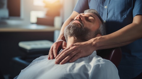 A close-up of a patient receiving chiropractic treatment in a corporate clinic.