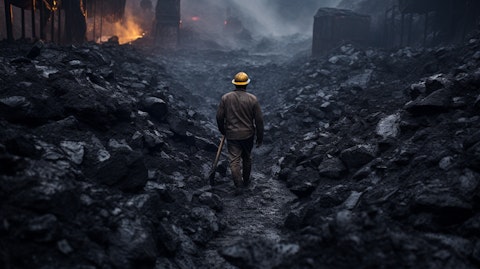 A coal miner surrounded by piles of bentonite and Leonardite in a mine.