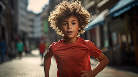 A youngster wearing the brand's latest athletic gear, perfectly captured mid-run.
