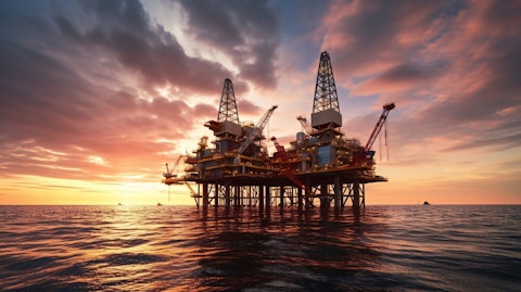 An offshore oil installation platform, its production arm reaching out to the horizon.