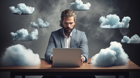 A tech savvy businessperson working on multiple devices, utilizing the company's cloud-based platform.