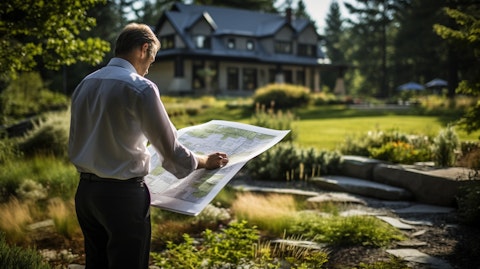 A landscape architect reviewing a blueprint of a landscaping project.