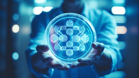 A technician holding a petri dish containing a DNA construction technology.