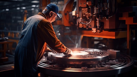 A worker operating a machine that produces round bars.