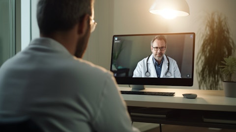 A doctor providing consultation to a patient through telemedicine technology.