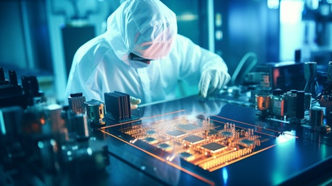 A technician in a lab coat inspecting a semiconductor laser.