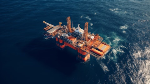 Aerial shot of an offshore oil platform, the orange hue of the ocean water and the steel structure representing the company’s extensive oil and gas production.