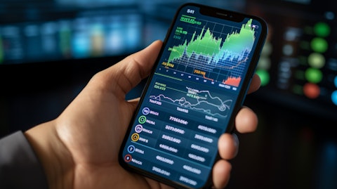 A close-up of a hand holding a smartphone, showcasing mobile financial applications.