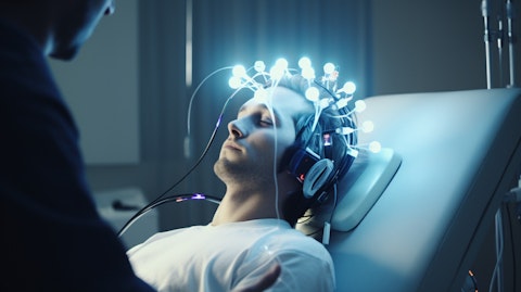 A doctor using a Neuromodulation device to examine a patient's brain activity.
