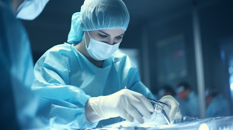 A doctor in surgical gloves performing a delicate operation using the company's products.