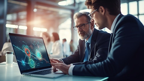 A doctor talking to a patient through a laptop, representing the digital health technology of the company.