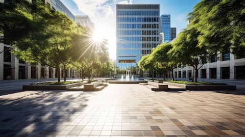 A wide-angle view of a plaza, showing a tall office building in Western US city.