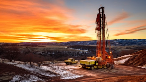A drilling rig lit up by the setting sun, against a backdrop of outdoor exploration in Colorado and Wyoming.