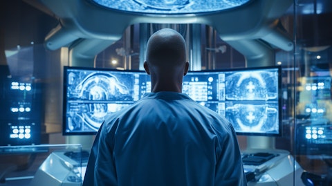 A radiologist monitoring the progress of radiation therapy on a patient.