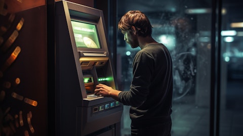 A customer withdrawing money from an ATM, illustrating the company's widespread availability of accounts.
