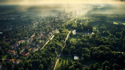 Aerial view of a group of transmission substations and surrounding city surrounded by trees.