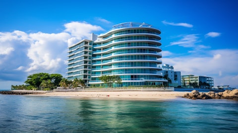 A view of a luxury seafront high-rise building in Grand Cayman, symbolizing the company's vast portfolio of investments.