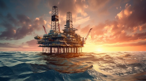 An oil rig in the middle of the ocean, its towering structure standing stout in the horizon.