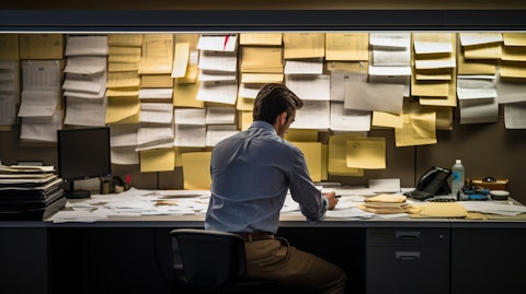 An employee counting notes in the back office of a bank.