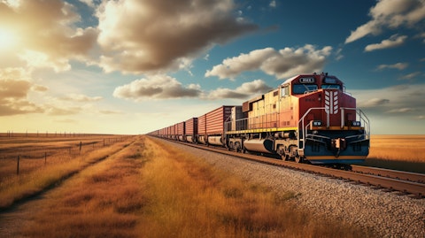 A busy freight train Traversing a vast expanse of land, carrying the company's cargo.