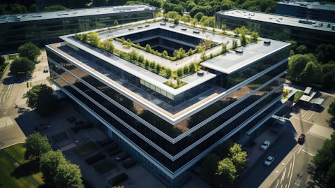 Aerial view of a modern office building, representing the industry of real estate and mortgage investments.