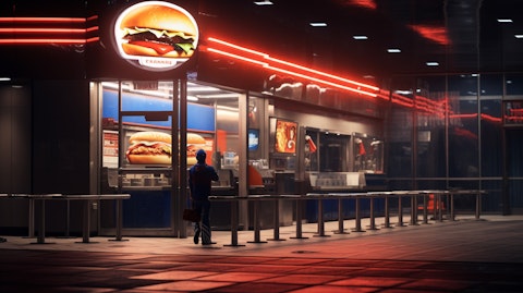 A Burger King sign with a loyal customer eagerly awaiting their order.