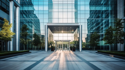 The entrance of a large corporate office building, symbolizing the headquarters of the REIT.