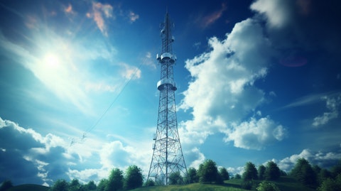 A telecommunications tower reaching high into the sky, connected to a satellite system.