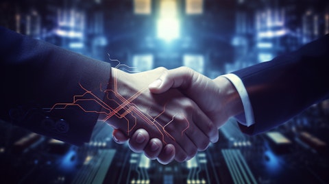 A corporate executive shaking hands with a customer, sealing the deal for a Digimarc watermark solution.