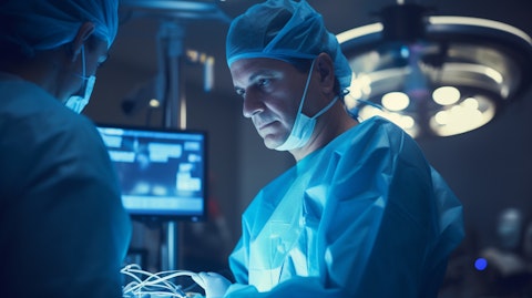 A surgeon using a bone growth stimulator device in a modern operating theatre.