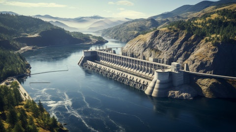 A stunning aerial view of a mountainside with a hydroelectric power station in the foreground.