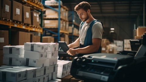 A warehouse worker unloading a line matrix printer in the background, showing the company's transportation and logistics capabilities.
