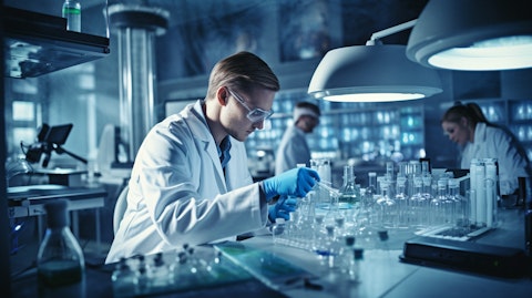 A research scientist working in their lab, developing a new drug candidate.