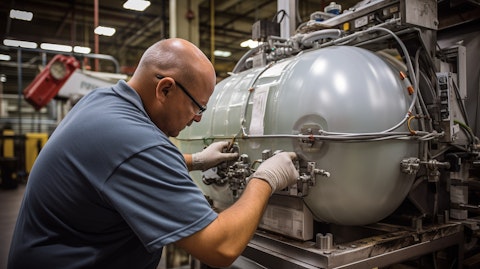 A technician calibrating a rigid and flexible intermediate bulk container machine.