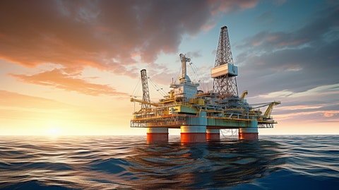 A modern offshore drilling vessel navigating the seas with equipment mounted on its decks.