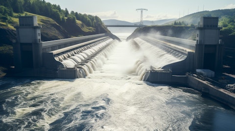 A view of a large hydroelectric dam, its turbines churning out renewable energy.