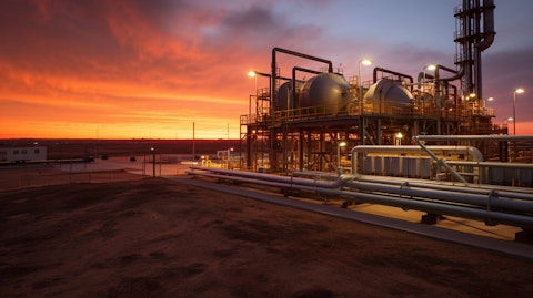 A broad sunset view of a modern oil & natural gas facility in the Permian Basin.