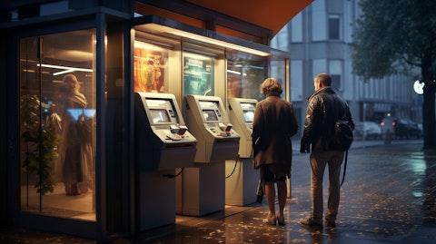An exterior view of an automatic teller machine with customers at the window.