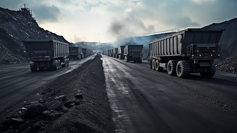 A coal-loading terminal with trucks lined up to be loaded.