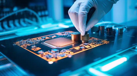A close-up of a technician's hands working on an advanced semiconductor substrate.