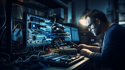 A technician programming a router in an industrial setting, hinting the company's telecom solutions.