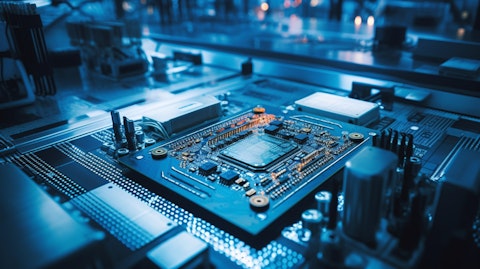 A technician overlooking a circuit board being built and tested for a semiconductor device.