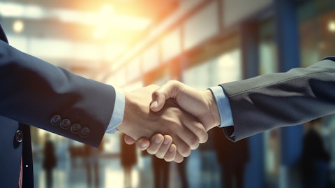 A top-ranking executive shaking hands with a representative of a public multinational corporation to close a major capital markets transaction.