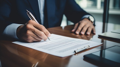 A customer signing a contract for a loan, displaying the secure and transparent services provided by the company.