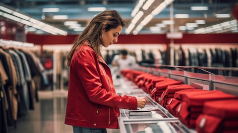 A woman shopping in one of the company's retail stores, searching for the perfect item.